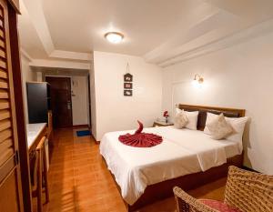 
Ein Bett oder Betten in einem Zimmer der Unterkunft Bonny Hotel
