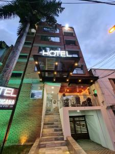 a hotel with stairs leading up to a building at Hotel Suramericana in Medellín