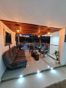 a living room with couches and chairs in a building at Hotel Suramericana in Medellín