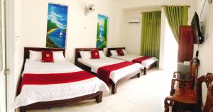 Postel nebo postele na pokoji v ubytování Đức Trọng Hotel