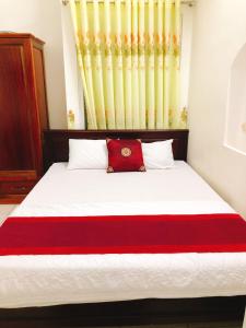Postel nebo postele na pokoji v ubytování Đức Trọng Hotel
