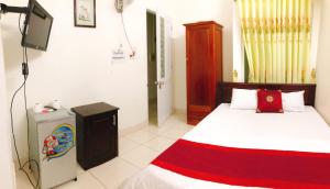 Postel nebo postele na pokoji v ubytování Đức Trọng Hotel