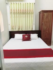 Postel nebo postele na pokoji v ubytování Đức Trọng Hotel