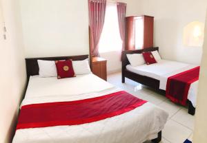 Postel nebo postele na pokoji v ubytování Đức Trọng Hotel