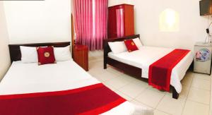 Postel nebo postele na pokoji v ubytování Đức Trọng Hotel