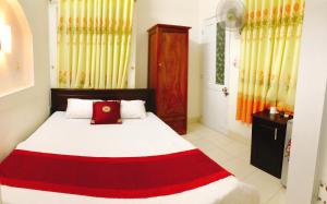 Postel nebo postele na pokoji v ubytování Đức Trọng Hotel