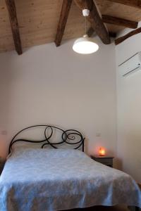 A bed or beds in a room at Agriturismo Mirasole