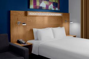 
a hotel room with a bed and a television at Holiday Inn Express Dubai Airport, an IHG Hotel in Dubai
