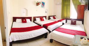 Postel nebo postele na pokoji v ubytování Đức Trọng Hotel
