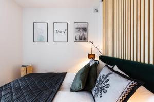 Posteľ alebo postele v izbe v ubytovaní Apartamenty Parzenica Zakopane