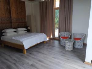 Postel nebo postele na pokoji v ubytování Finolhu Beach Guest House