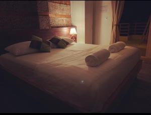 Postel nebo postele na pokoji v ubytování Finolhu Beach Guest House