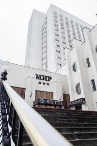 a large building with a clock on the side of it at Hotel Mir in Kyiv