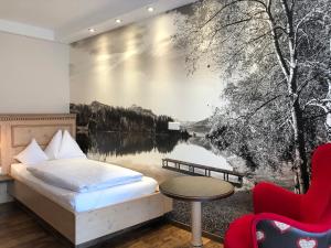 Ein Bett oder Betten in einem Zimmer der Unterkunft Hotel Sommer-Haus am See