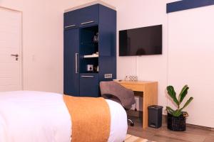 Villa Portia tesisinde bir odada yatak veya yataklar