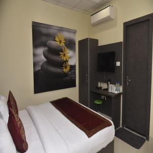Voodi või voodid majutusasutuse HOTEL TRIDEV GRAND toas