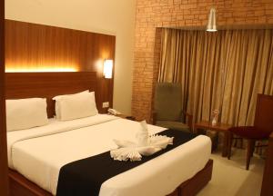 Postel nebo postele na pokoji v ubytování Orbett Hotel