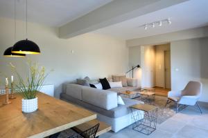 a living room with a couch and a table at Amfikleia Home by Relax in Greece in Amfiklia
