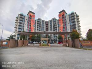 an empty parking lot in front of tall buildings at Sky Garden Penthouses in Chemor