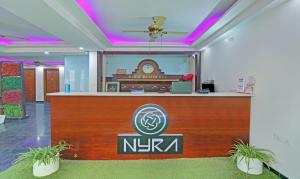 a lobby of a nirvana hotel with a reception desk at Itsy by Treebo - Nyra Sector 22 in Gurgaon