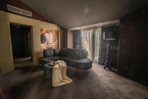 a living room with a couch and a table at Atik Hotel in Unye