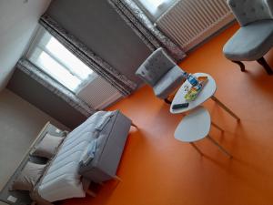 an overhead view of a living room with chairs and a table at CH MALAVETULA in Chastel-Nouvel