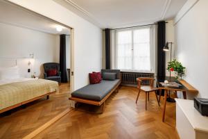Un pat sau paturi într-o cameră la Marktgasse Hotel