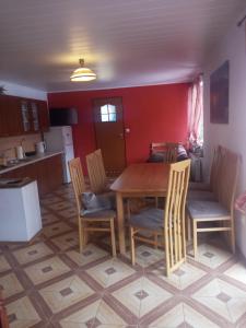 a kitchen with a table and chairs in a room at Bieszczady noclegi ,,U Andrzeja'' in Polańczyk