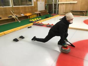 a man is playing a game of bowling at Santari in Shintoku