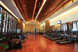 a gym with rows of treadmills and exercise bikes at Crowne Plaza Danang in Danang