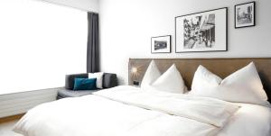 Ένα ή περισσότερα κρεβάτια σε δωμάτιο στο Hotel Zugertor