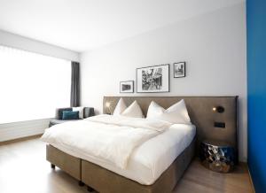 Ένα ή περισσότερα κρεβάτια σε δωμάτιο στο Hotel Zugertor