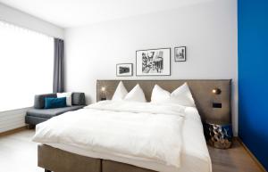 Ένα ή περισσότερα κρεβάτια σε δωμάτιο στο Hotel Zugertor