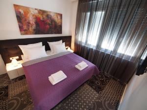 Ένα ή περισσότερα κρεβάτια σε δωμάτιο στο Decanska Apartments +58 φωτογραφίες