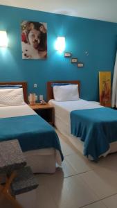 Tempat tidur dalam kamar di Condomínio Encantador Piscina e Praia E12
