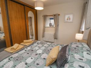 a bedroom with a large bed in a room at Dales Barn Top in Hawes