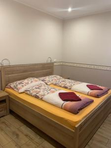 מיטה או מיטות בחדר ב-Villa Gracia Podhájska