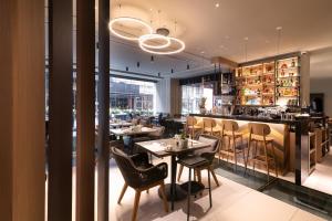 a restaurant with tables and chairs and a bar at S Hotel Boutique Thessaloniki in Thessaloniki +100 photos