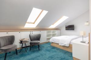 Łóżko lub łóżka w pokoju w obiekcie Aparthotel Esencja Warszawy Nowy Świat