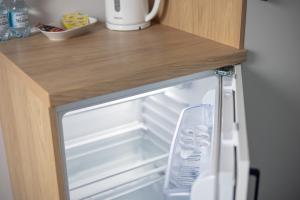 Kuchyň nebo kuchyňský kout v ubytování Aparthotel Esencja Warszawy Nowy Świat