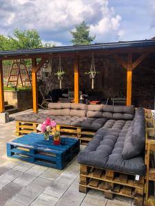 a group of couches sitting on a patio at Penzion Nový Svět in Krásno