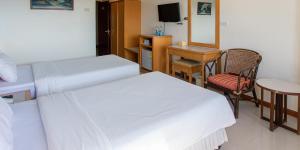 Postel nebo postele na pokoji v ubytování Hadthong Hotel