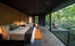 Voodi või voodid majutusasutuse Rio Perdido Hotel & Thermal River toas