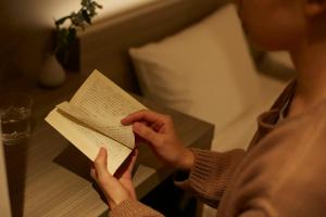 a man is holding a piece of paper at FAV HOTEL ISE in Ise