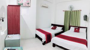 Postel nebo postele na pokoji v ubytování Đức Trọng Hotel