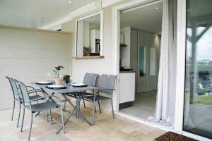 Balkón nebo terasa v ubytování Les Alizés Bleus - Cosy appartement avec piscine