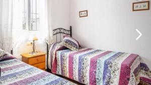 Posteľ alebo postele v izbe v ubytovaní Casa Colada 3