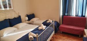 Postel nebo postele na pokoji v ubytování Napol-In