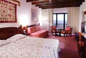 Postel nebo postele na pokoji v ubytování HOTEL SPA MONTANA