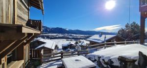 a view of a town in the snow from a house at Chalet Vista - bolquère in Bolquere Pyrenees 2000